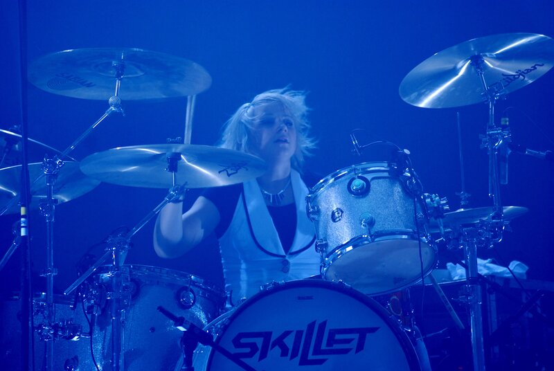 Woman Playing Drums — Blue