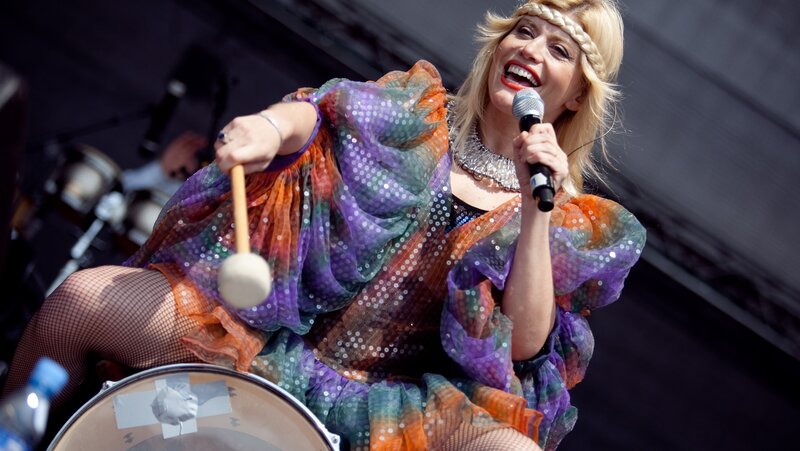 Woman Playing Drums — Purple