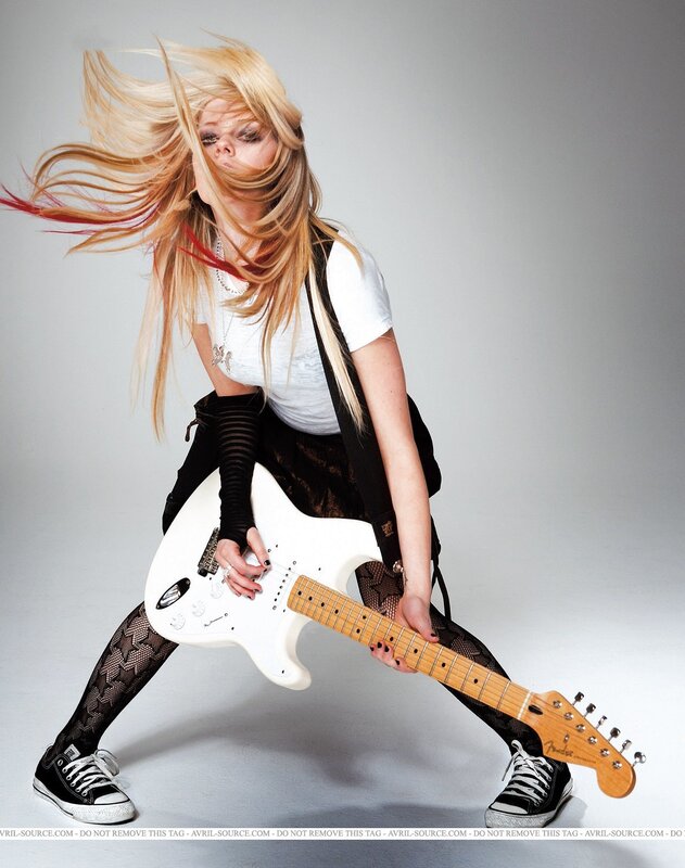 woman playing electric guitar