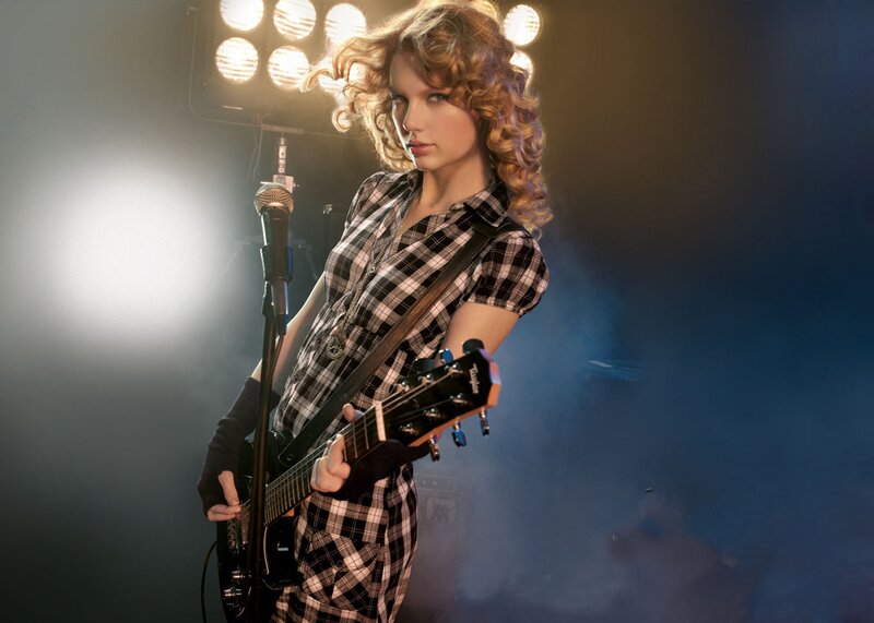 woman playing electric guitar