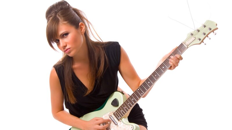 woman playing electric guitar