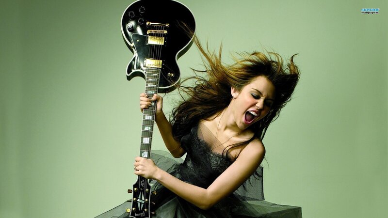 woman playing electric guitar