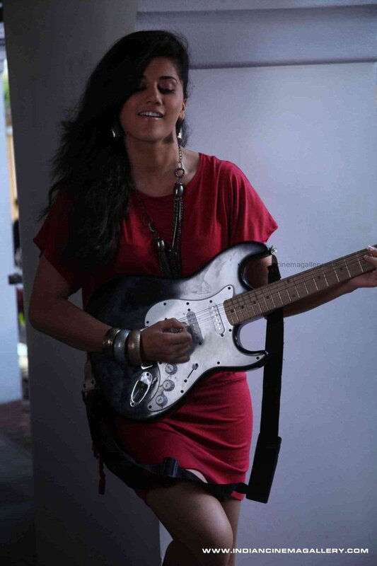 woman playing electric guitar
