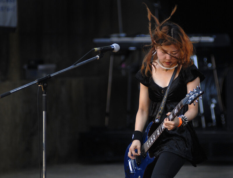 Woman Playing Electric Guitar — Black, Energetic