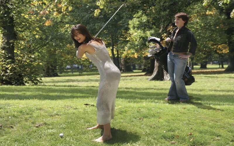 Woman playing golf in park