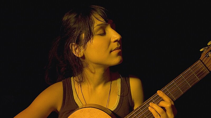 Woman Playing Guitar — Black, Dramatic, Night, Photograph