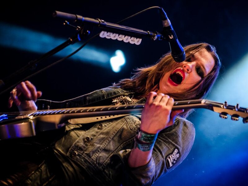 Woman Playing Guitar — Blue, Intense