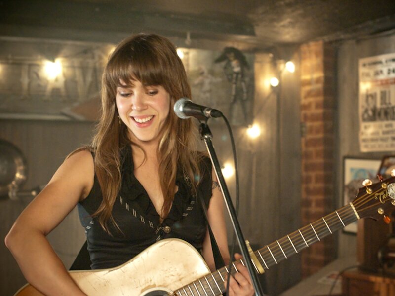 Woman Playing Guitar — Brown, Joyful