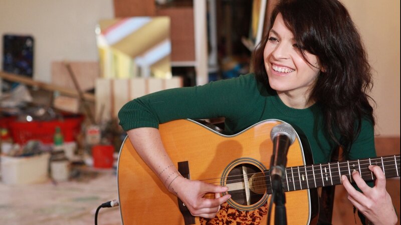 Woman Playing Guitar — Green, Happy