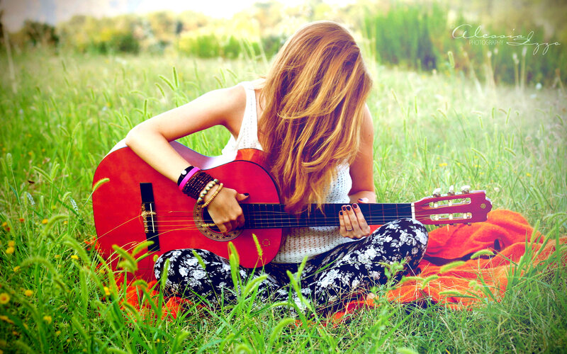 Woman Playing Guitar — Green, Serene, Afternoon, Photograph, Grass