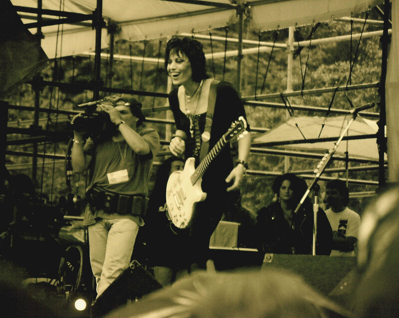 Woman Playing Guitar on Stage — Sepia