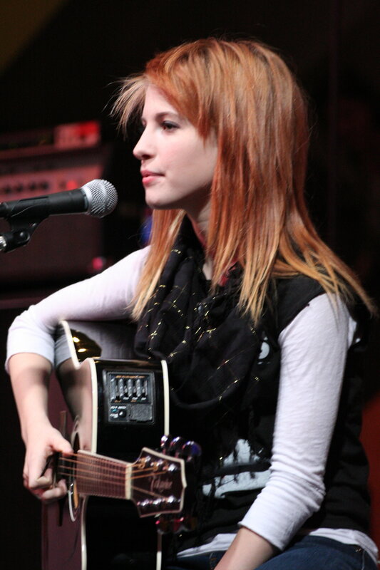 Woman Playing Guitar — Red, Focused