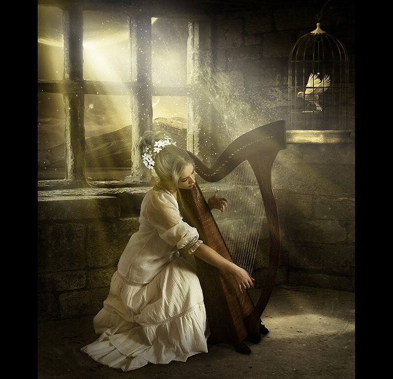 Woman playing harp in stone room