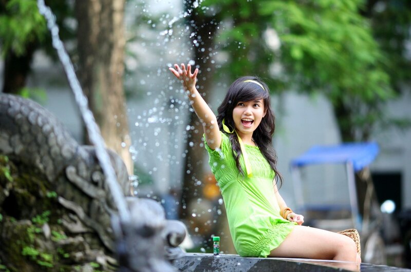 Woman playing in fountain
