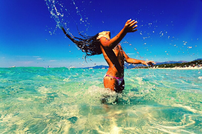 woman playing in ocean water