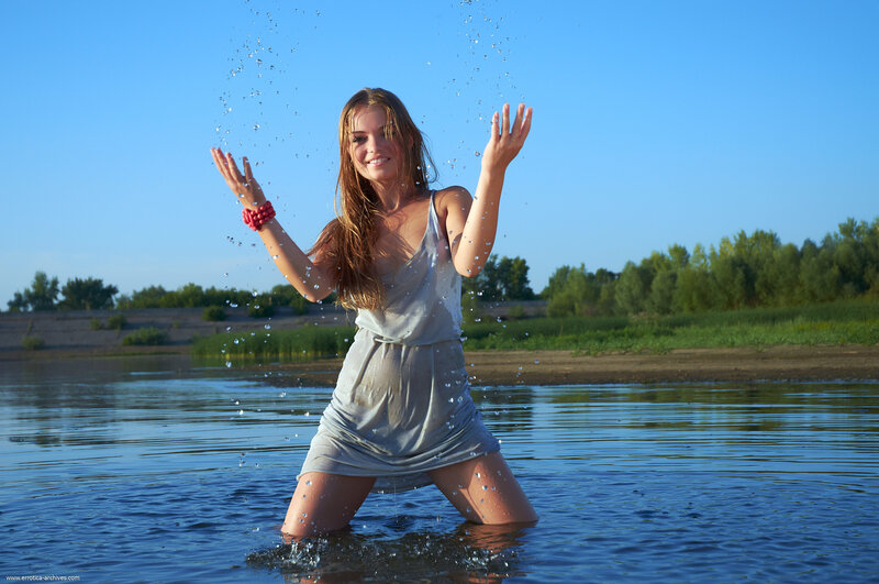 woman playing in river water