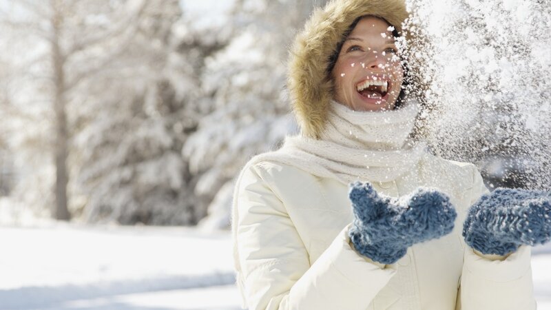 woman playing in snow