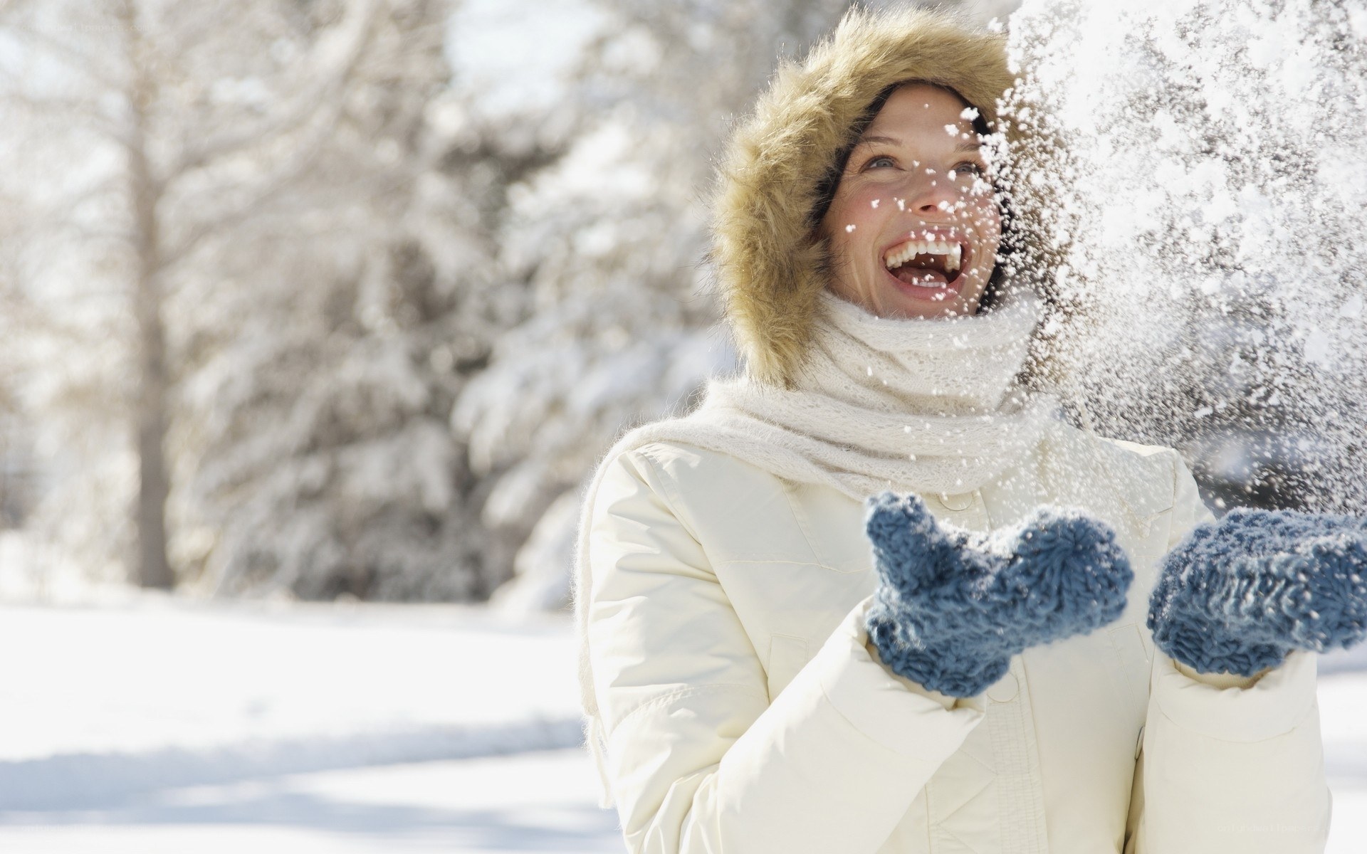 woman playing in snow