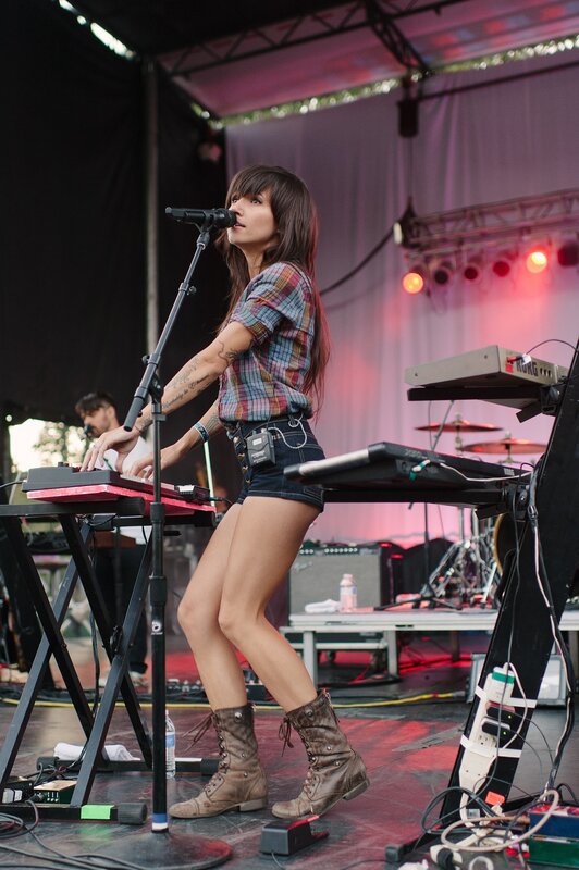 woman playing keyboard on stage