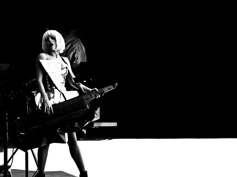 woman playing keyboard on stage