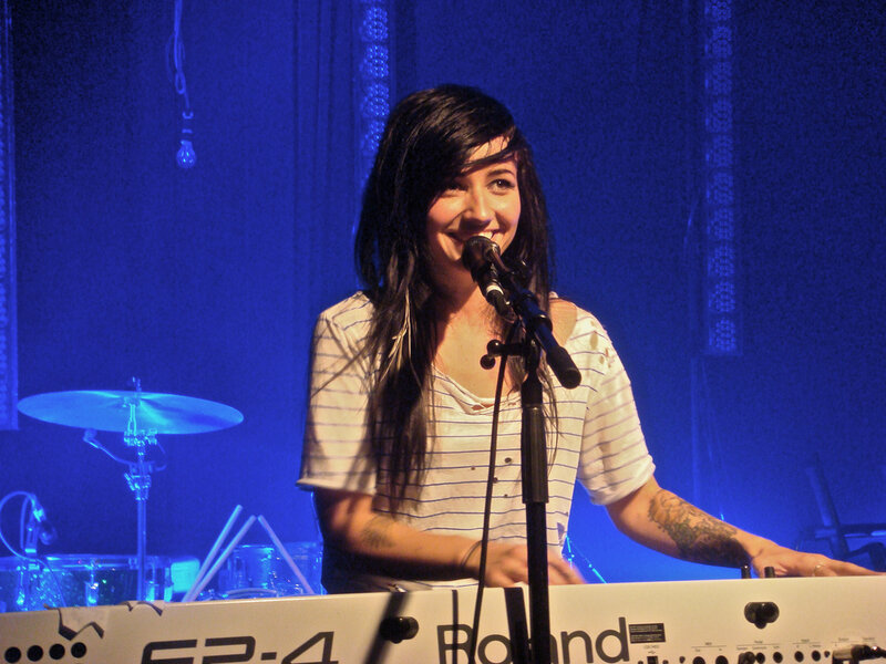 woman playing keyboard on stage