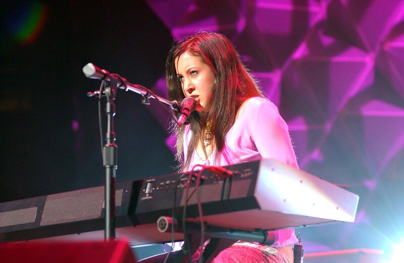 woman playing keyboard on stage