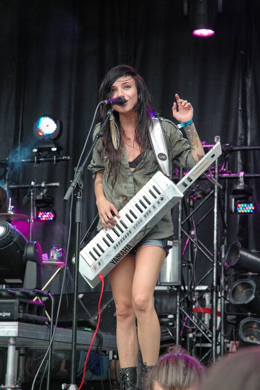Woman playing keyboard on stage