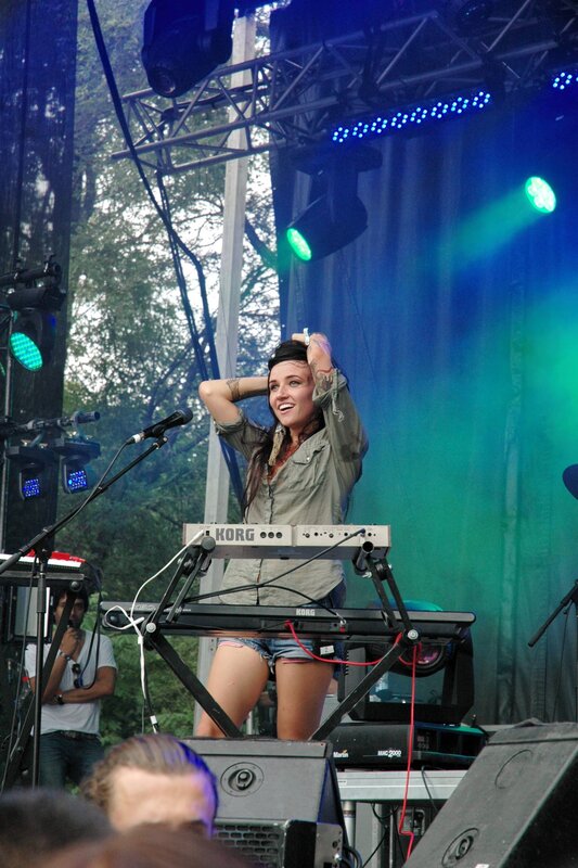 Woman playing keyboard on stage
