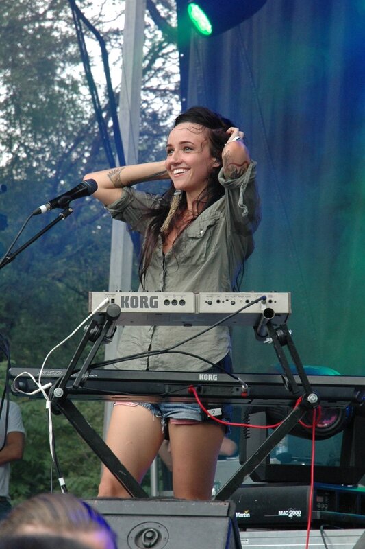 Woman playing keyboard on stage