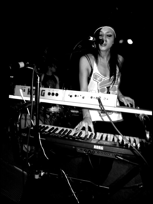 woman playing keyboard on stage