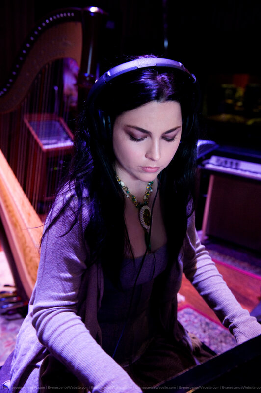woman playing keyboard with headphones