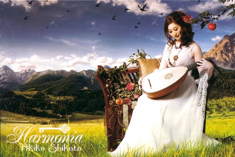 Woman playing lute in a field