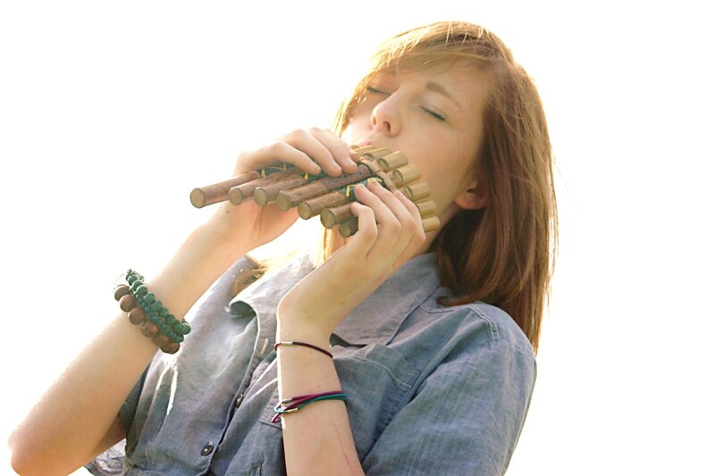 woman playing pan flute