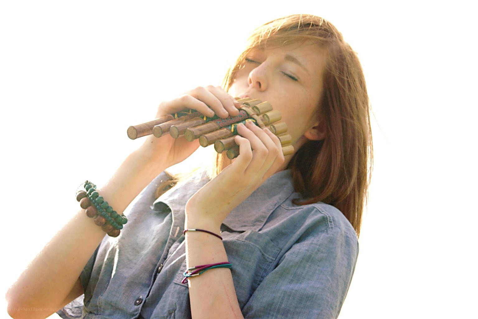 woman playing pan flute