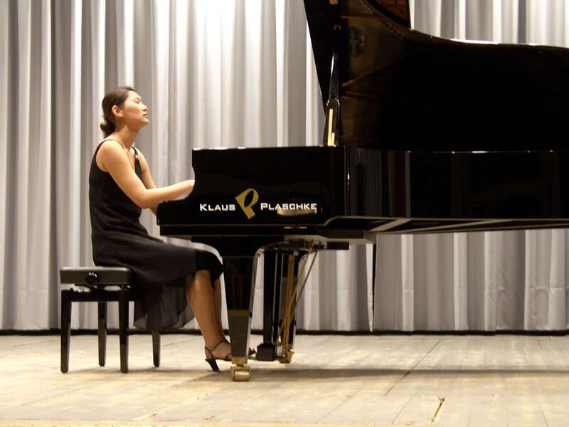Woman Playing Piano — Black, Focused
