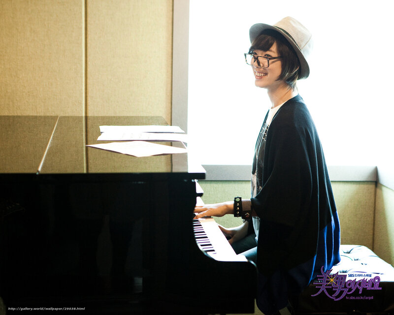 woman playing piano by window