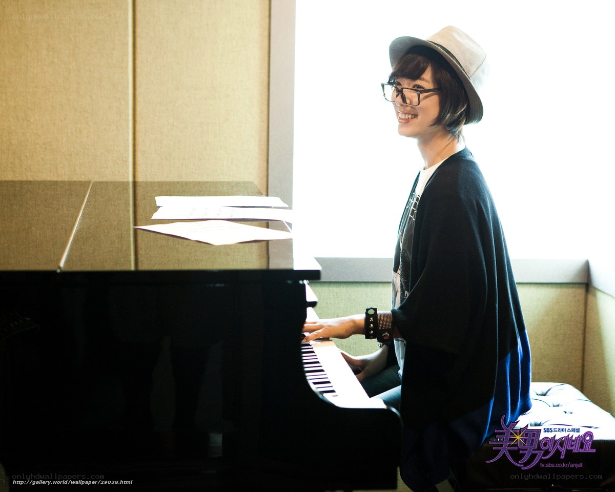 woman playing piano by window