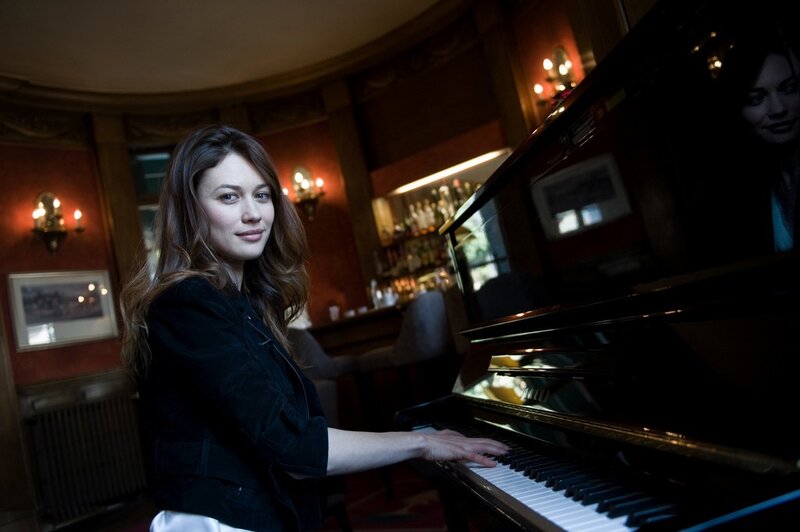 woman playing piano in a bar
