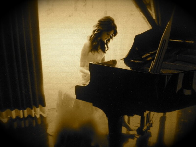 woman playing piano in sepia