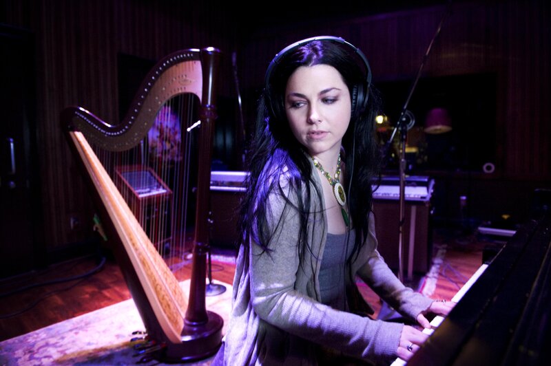 woman playing piano in studio