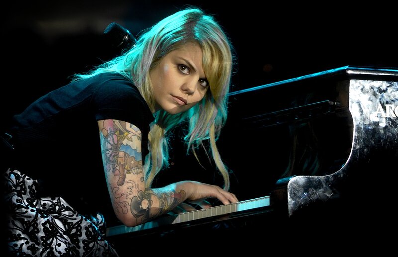 woman playing piano on stage