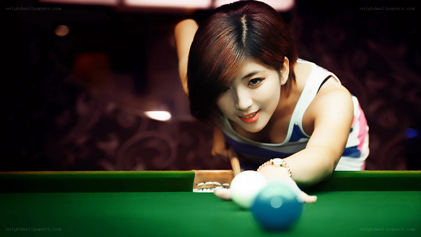 woman playing pool