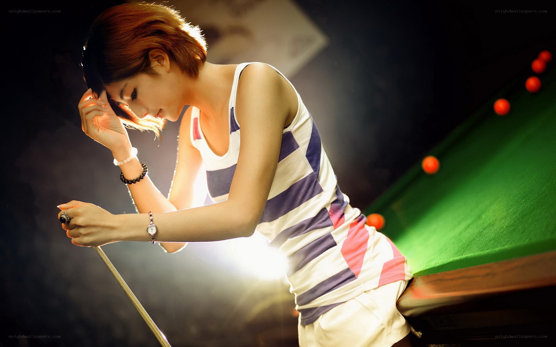 woman playing pool