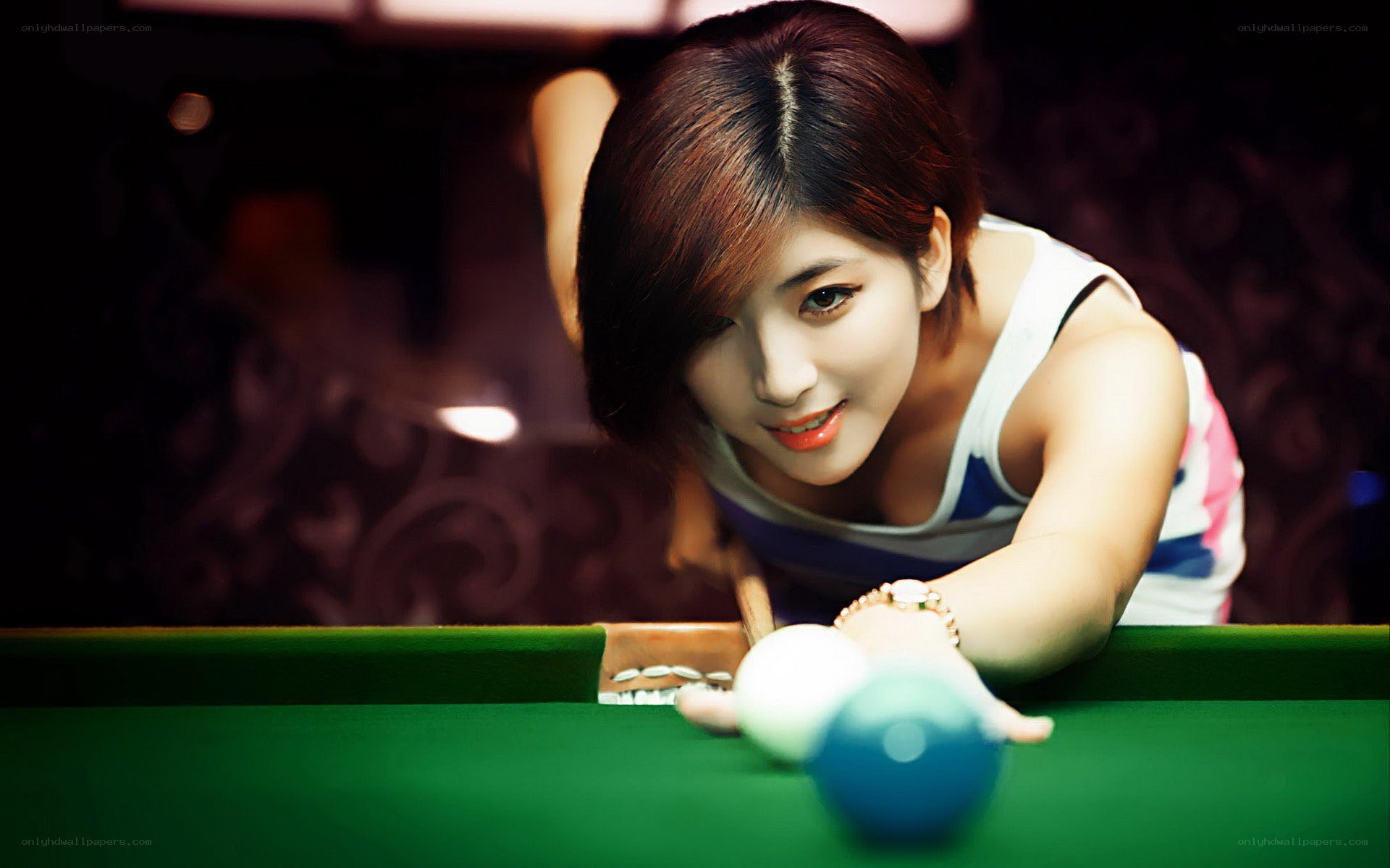 woman playing pool