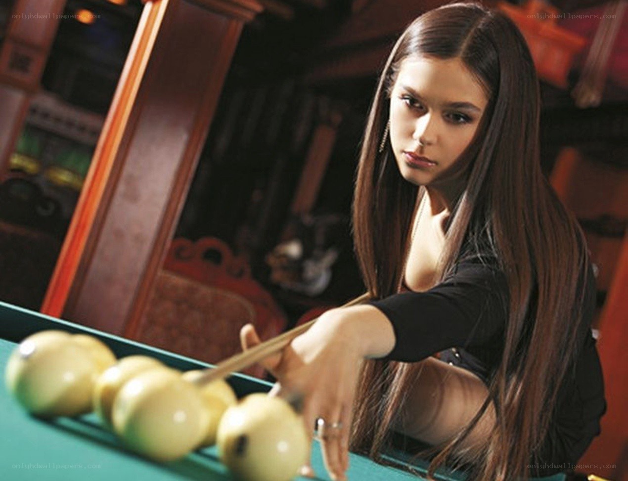 woman playing pool