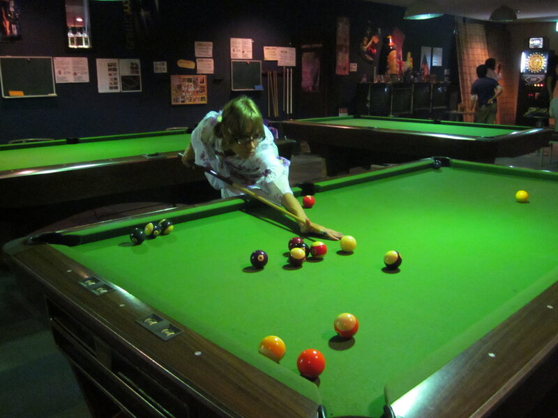Woman Playing Pool — Green, Focused, Night, Photograph, Pool Table