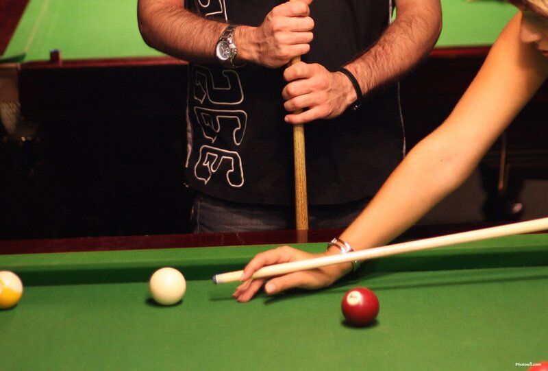 Woman Playing Pool — Green, Focused