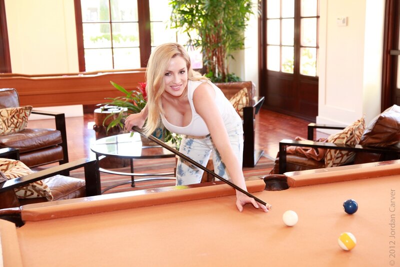 Woman playing pool indoors