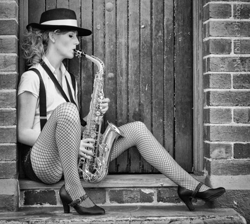 Woman Playing Saxophone — Black
