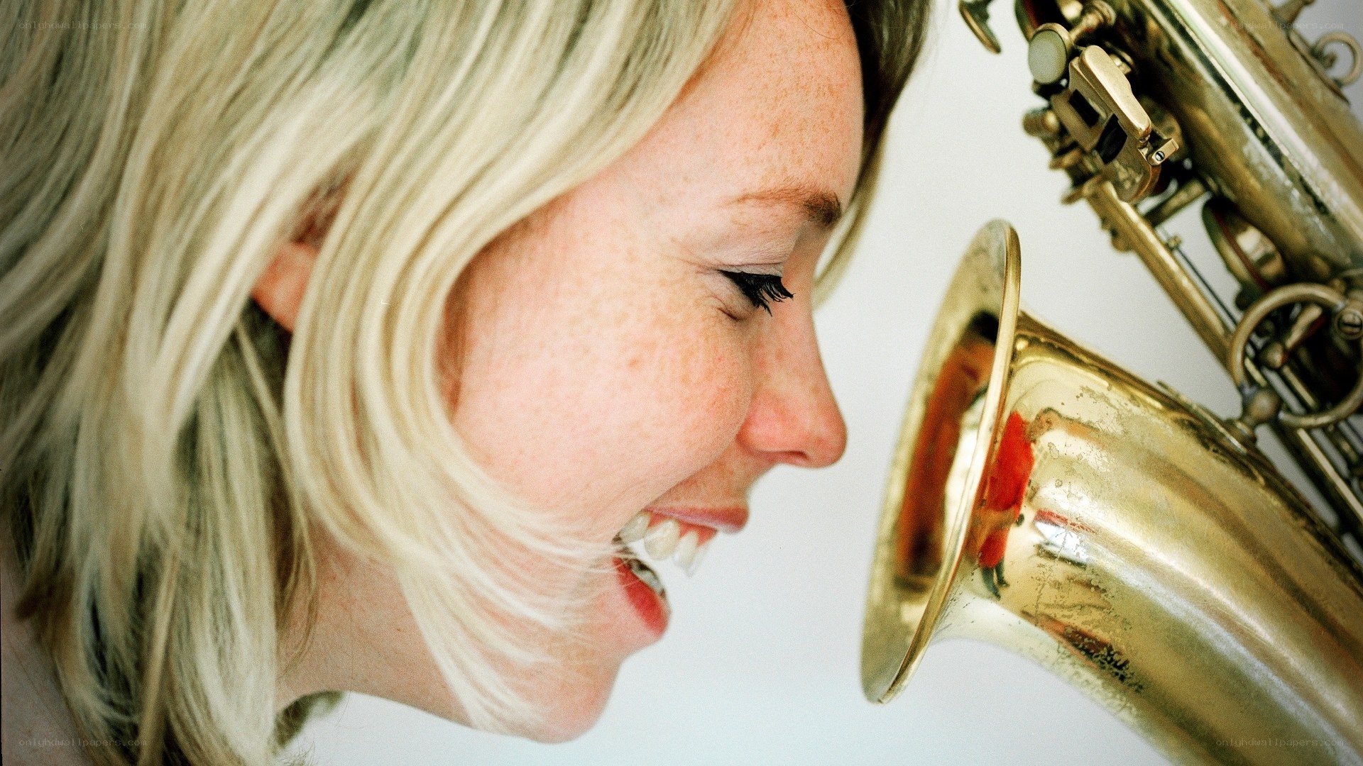 woman playing saxophone